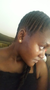 Side cornrows-protective style done by Sandra